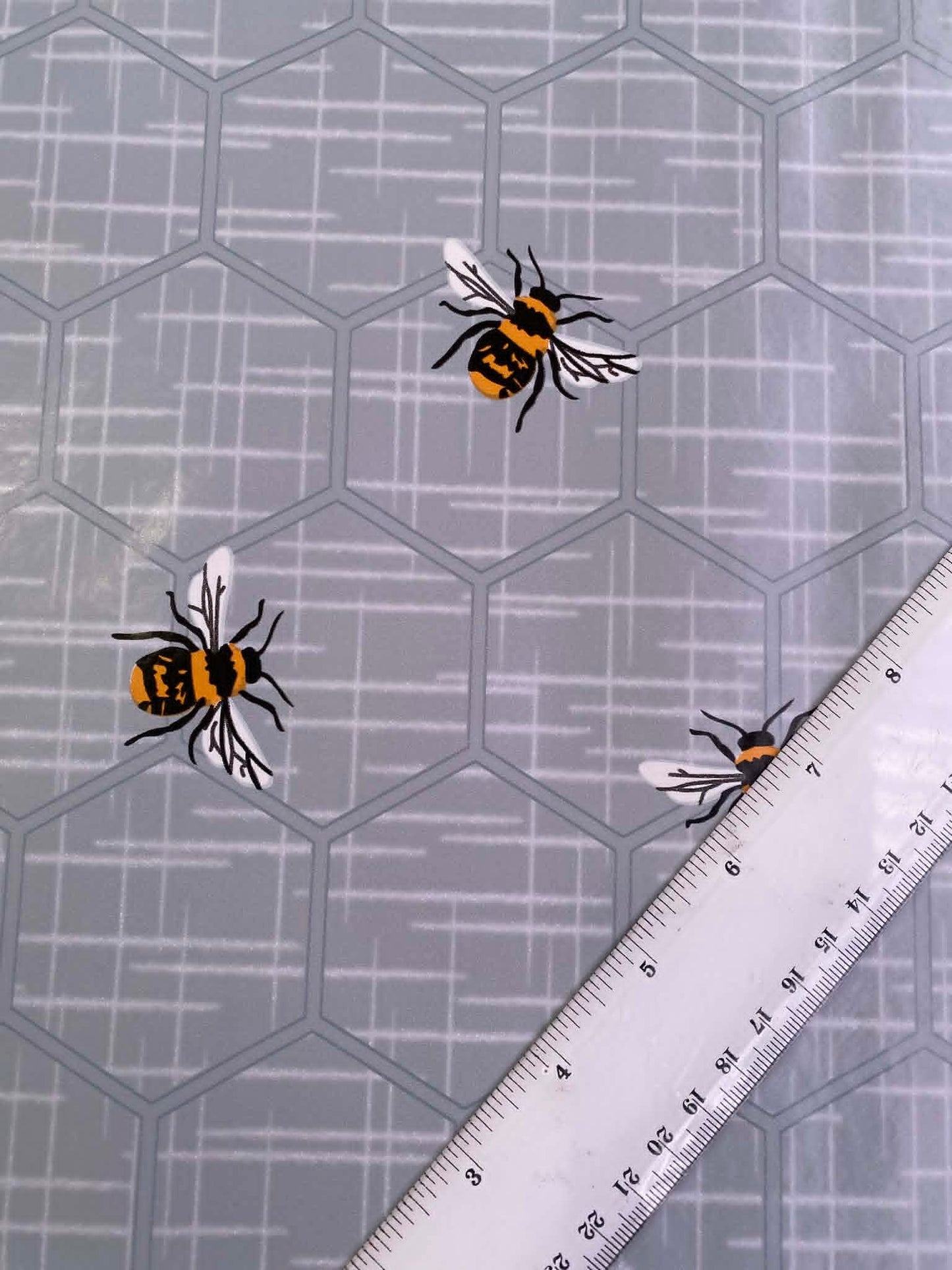 Grey & Orange Bee Print PU Table Covering - 55" Wide - Nature Inspired - Wipe Clean - £1.99/m