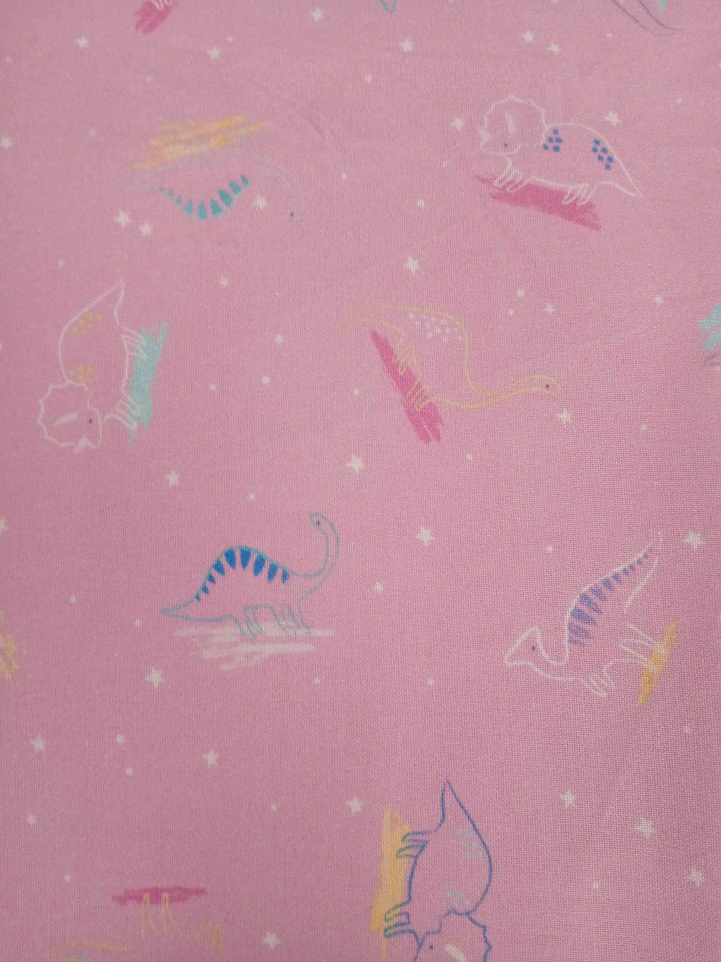 100% Cotton - Dinosaurs - Pink/Blue/Yellow - 44" Wide - Sold By The Metre